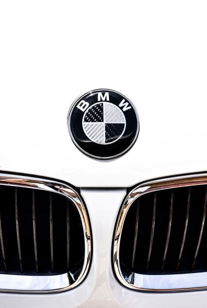 front of a white bmw
